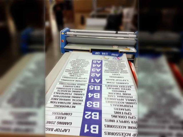 Laminated shelf navigation signs